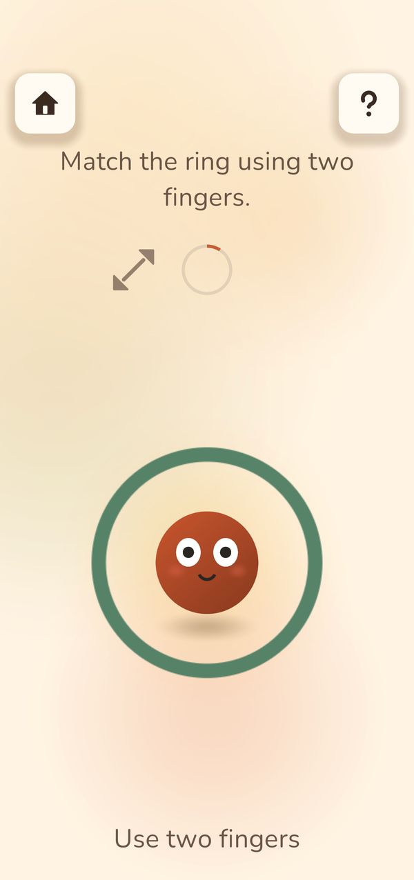 Pinch and Stretch during play: a ring with a small face and the words Use two fingers